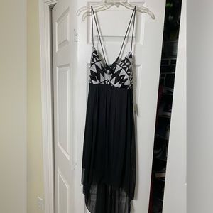 This is a black and white sequence size 9 Teeze Me cocktail dress.
